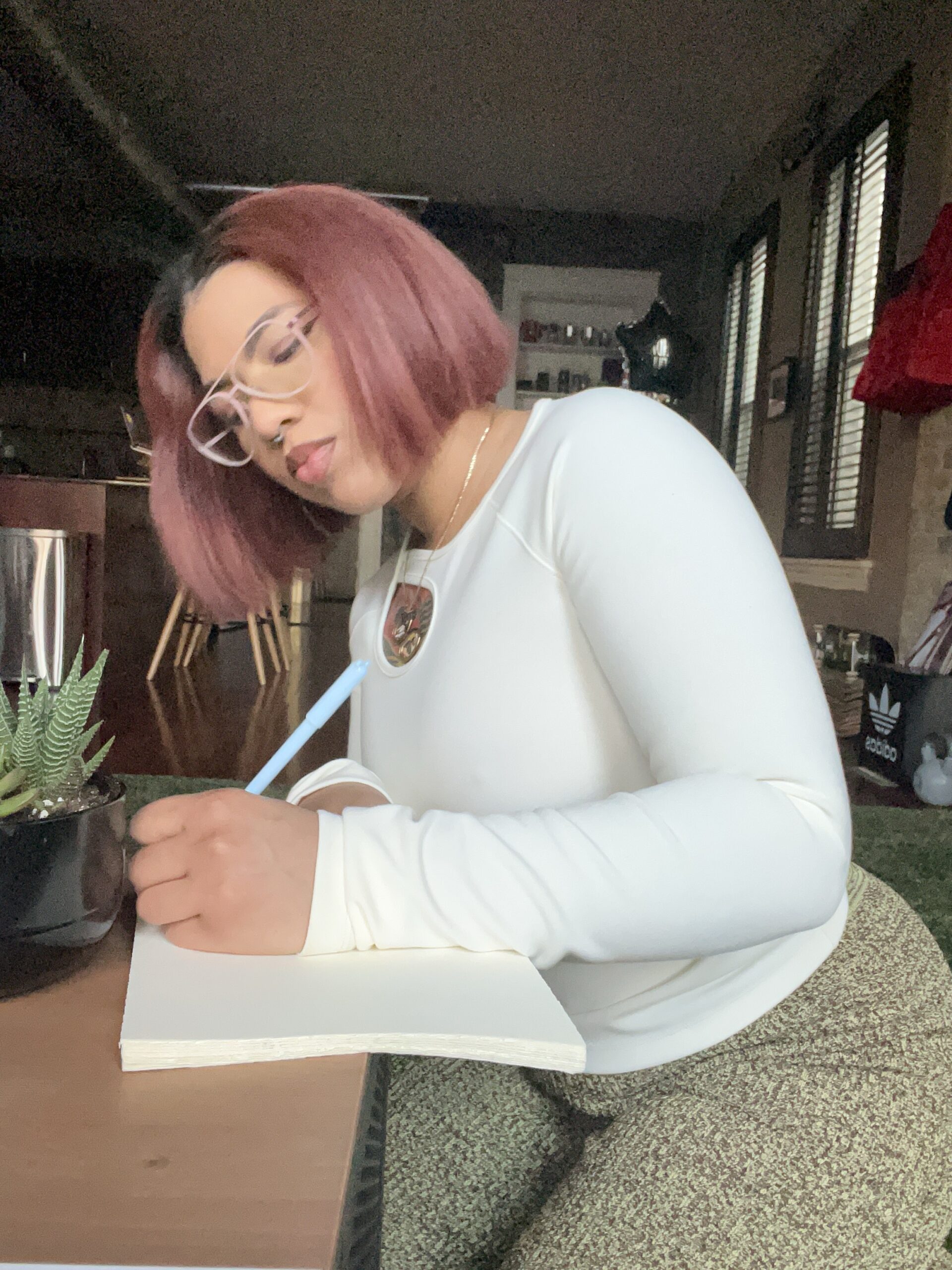 Natasha Estevez writing in her journal.